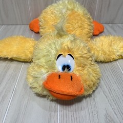 Classic toy Plush duck lying down yellow orange tie dye plastic white blue eye