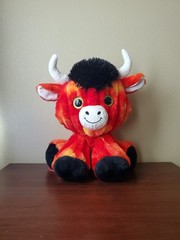 red orange black white glittered eyes buster bull plush toy